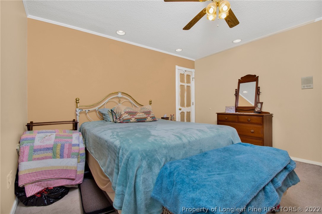 1197 Rowan Road Lumberton, NC 28358 - Photo 22 of 37 a bedroom with a bed and dresser