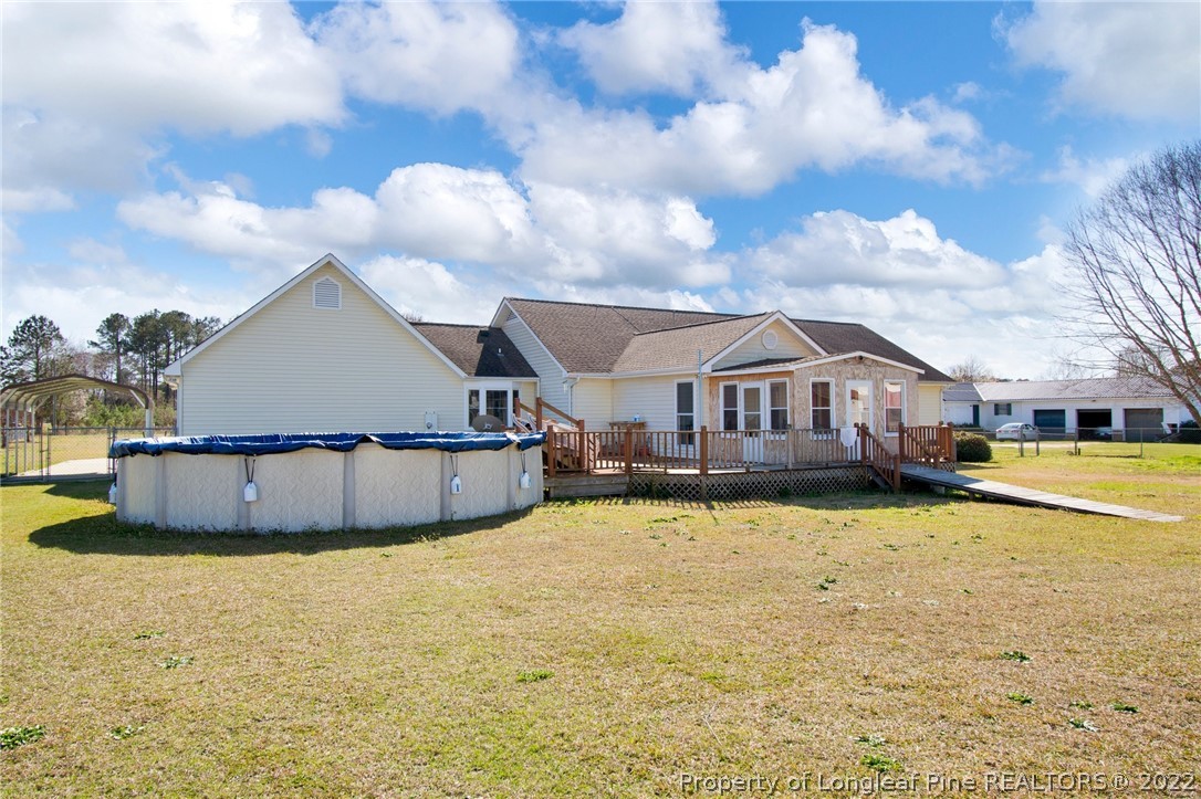 1197 Rowan Road Lumberton, NC 28358 - Photo 32 of 37 a view of a house with a swimming pool and sitting area