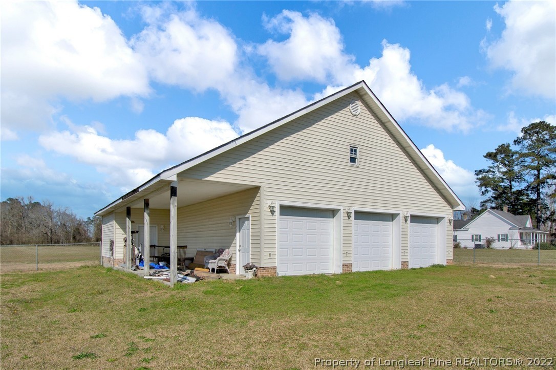 1197 Rowan Road Lumberton, NC 28358 - Photo 35 of 37 a view of a house with a yard