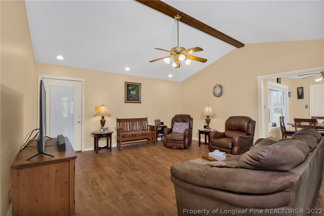 1197 Rowan Road Lumberton, NC 28358 - Photo 8 of 37 a living room with furniture and wooden floor