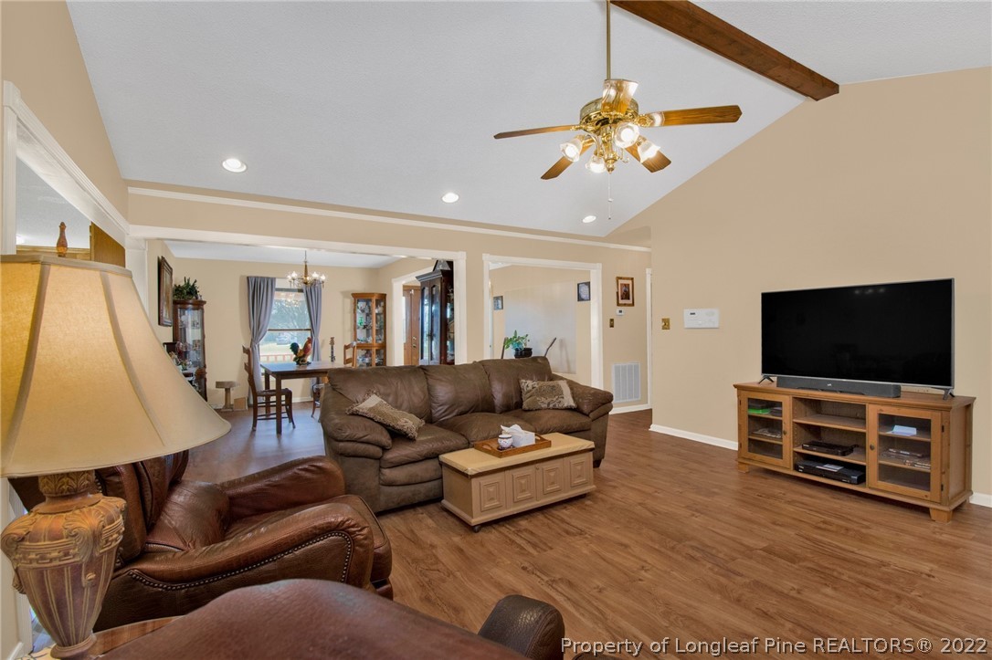 1197 Rowan Road Lumberton, NC 28358 - Photo 10 of 37 a living room with furniture and a flat screen tv