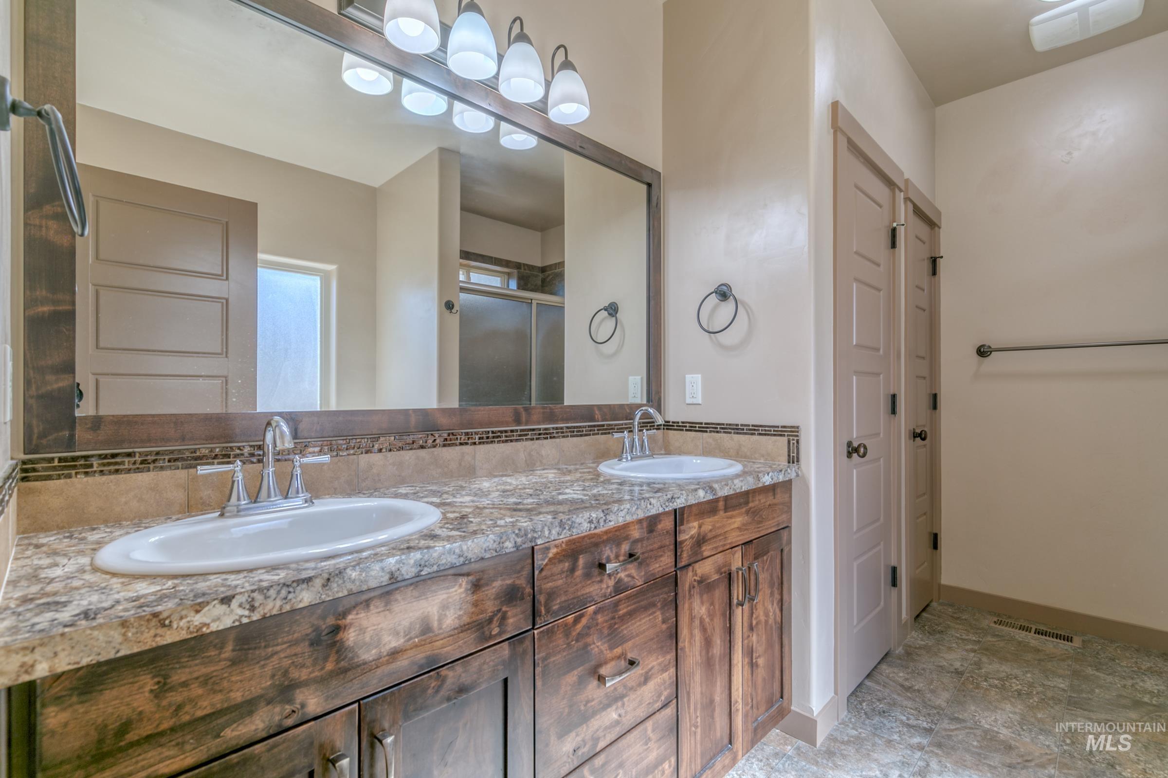 4316 Middlesboro Way Caldwell, ID 83607 - Photo 23 of 33 Tray ceiling with recessed lighting, ceiling fan, and carpeted flooring
