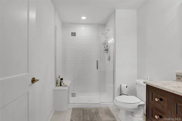 a front view of a house with a garden and parking