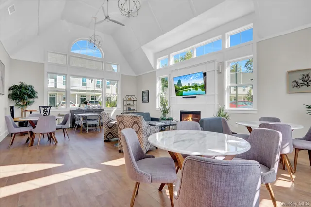 a dining room with furniture and window
