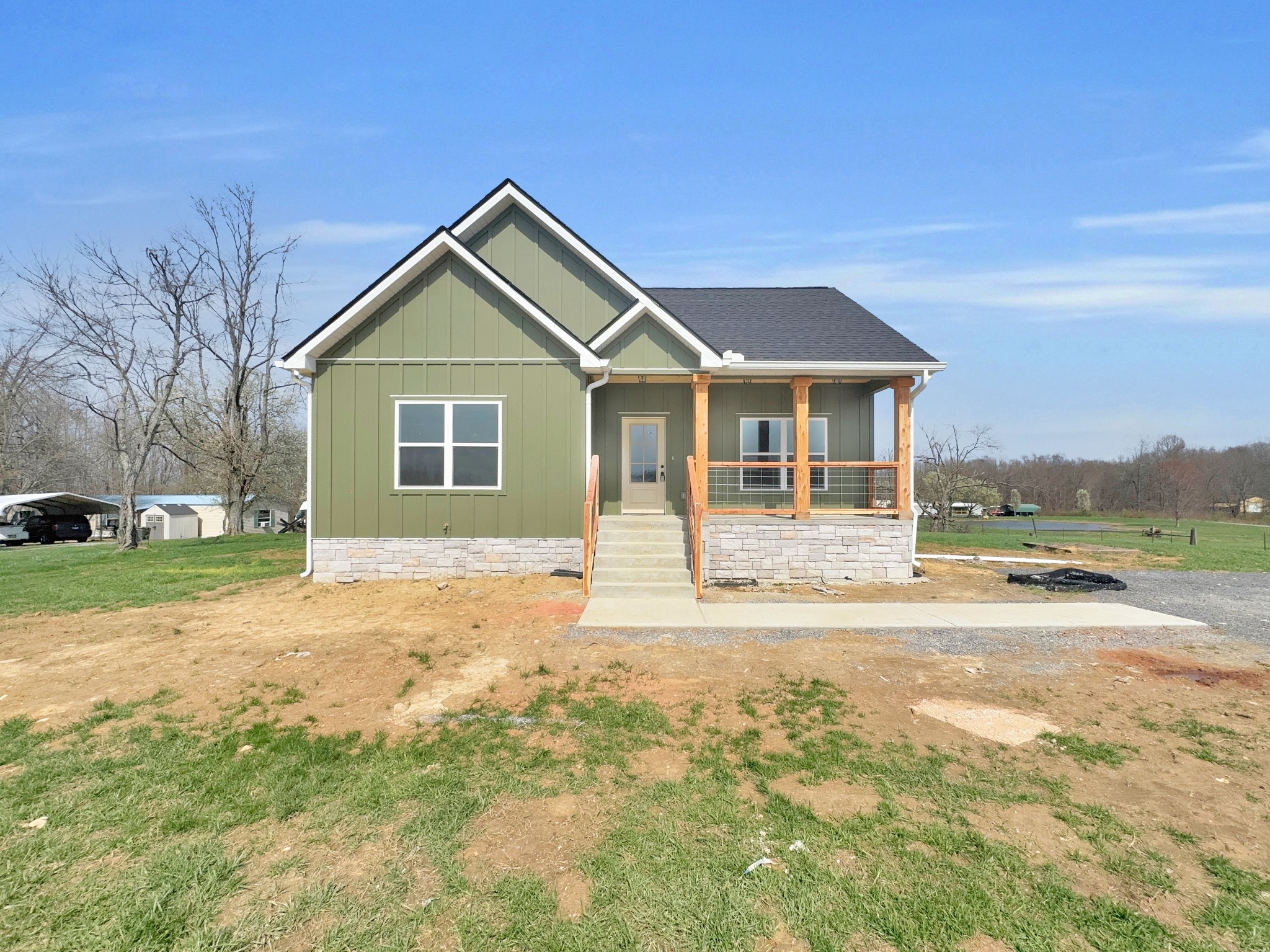 a view of a house with a yard and garage