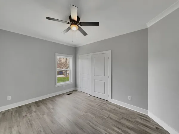 a view of a garden with a bench in the patio