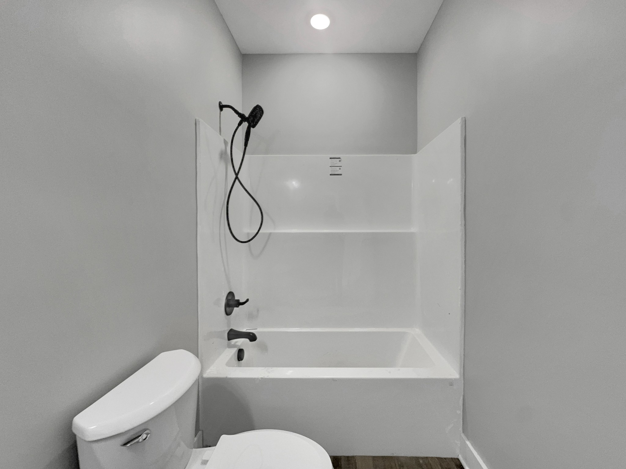 181 Rock House Hollow Road Bethpage, TN 37022 - Photo 29 of 50 a bathroom with a granite countertop toilet and a shower