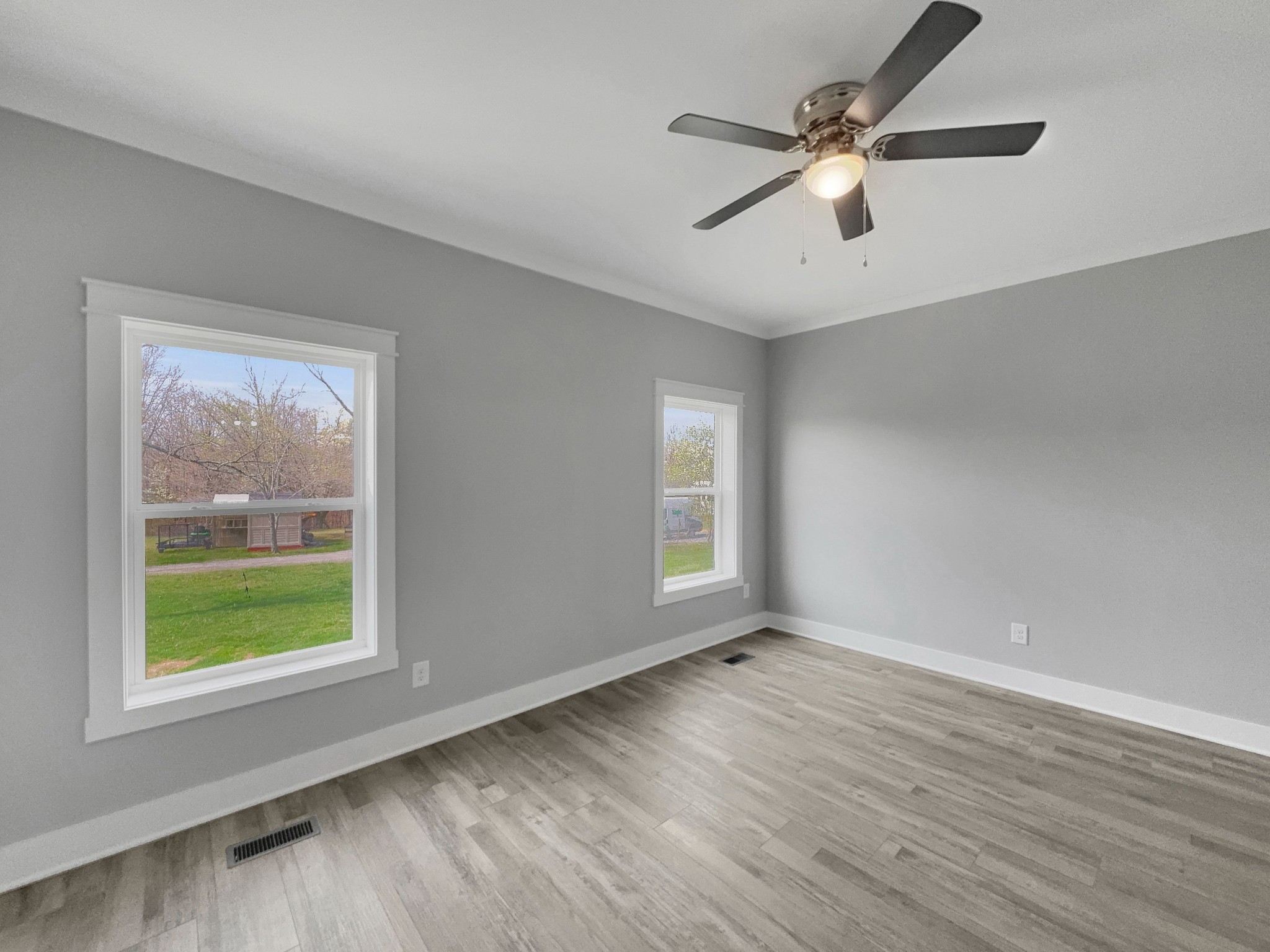 181 Rock House Hollow Road Bethpage, TN 37022 - Photo 30 of 50 a view of an empty room with wooden floor and a window