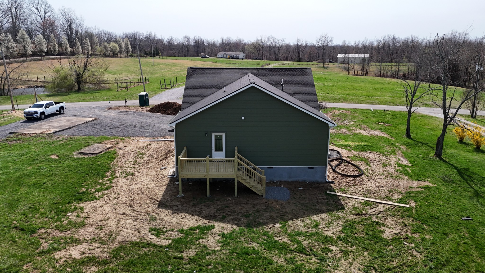 181 Rock House Hollow Road Bethpage, TN 37022 - Photo 37 of 50 a view of a garden with a bench in the patio