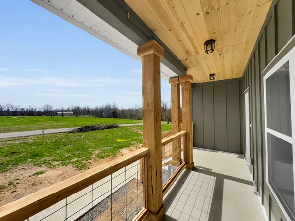 a view of a room window and wooden floor