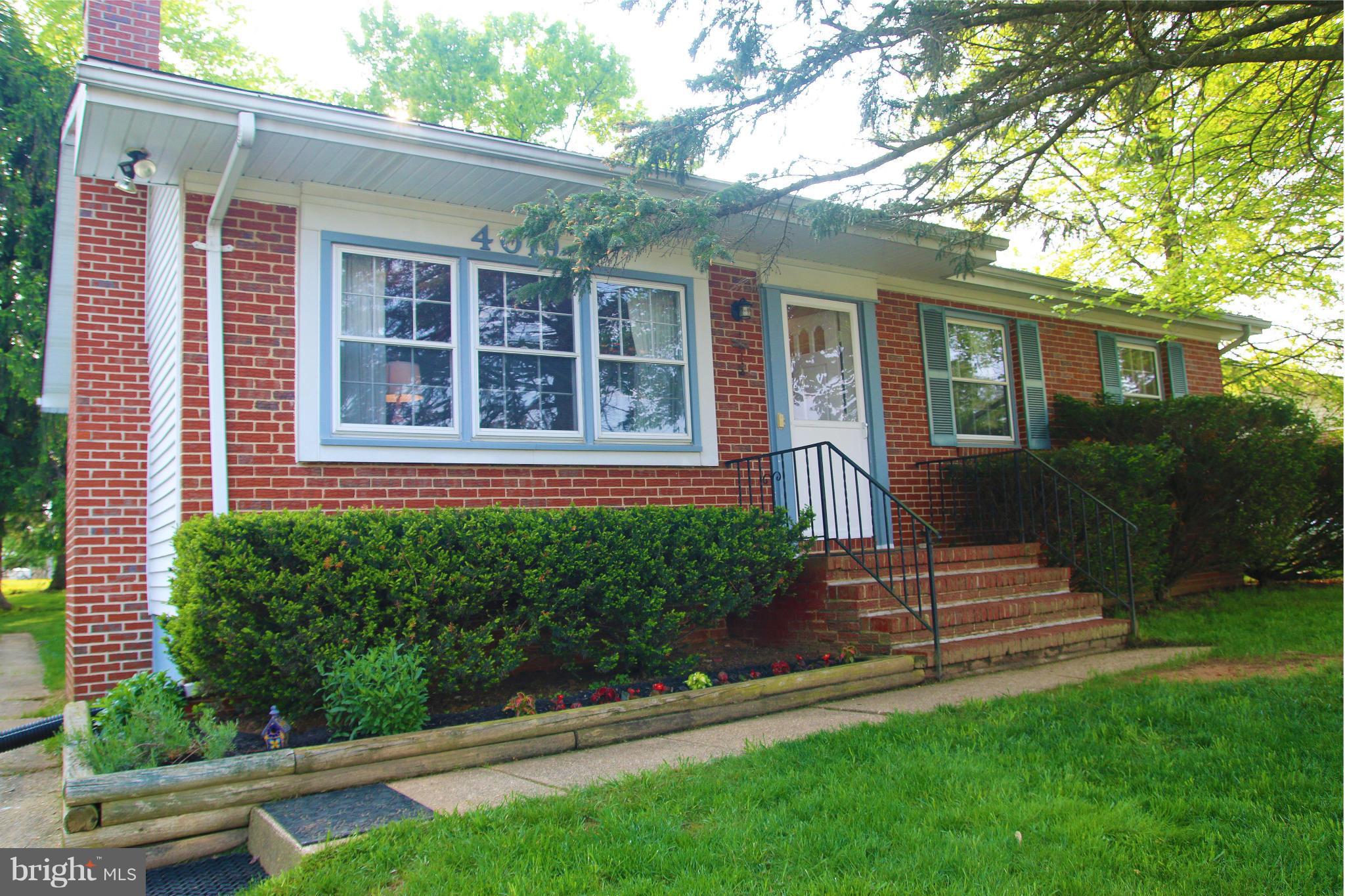 4019 Starbrook Road Randallstown, MD 21133 - Photo 1 of 28 a front view of a house with a yard