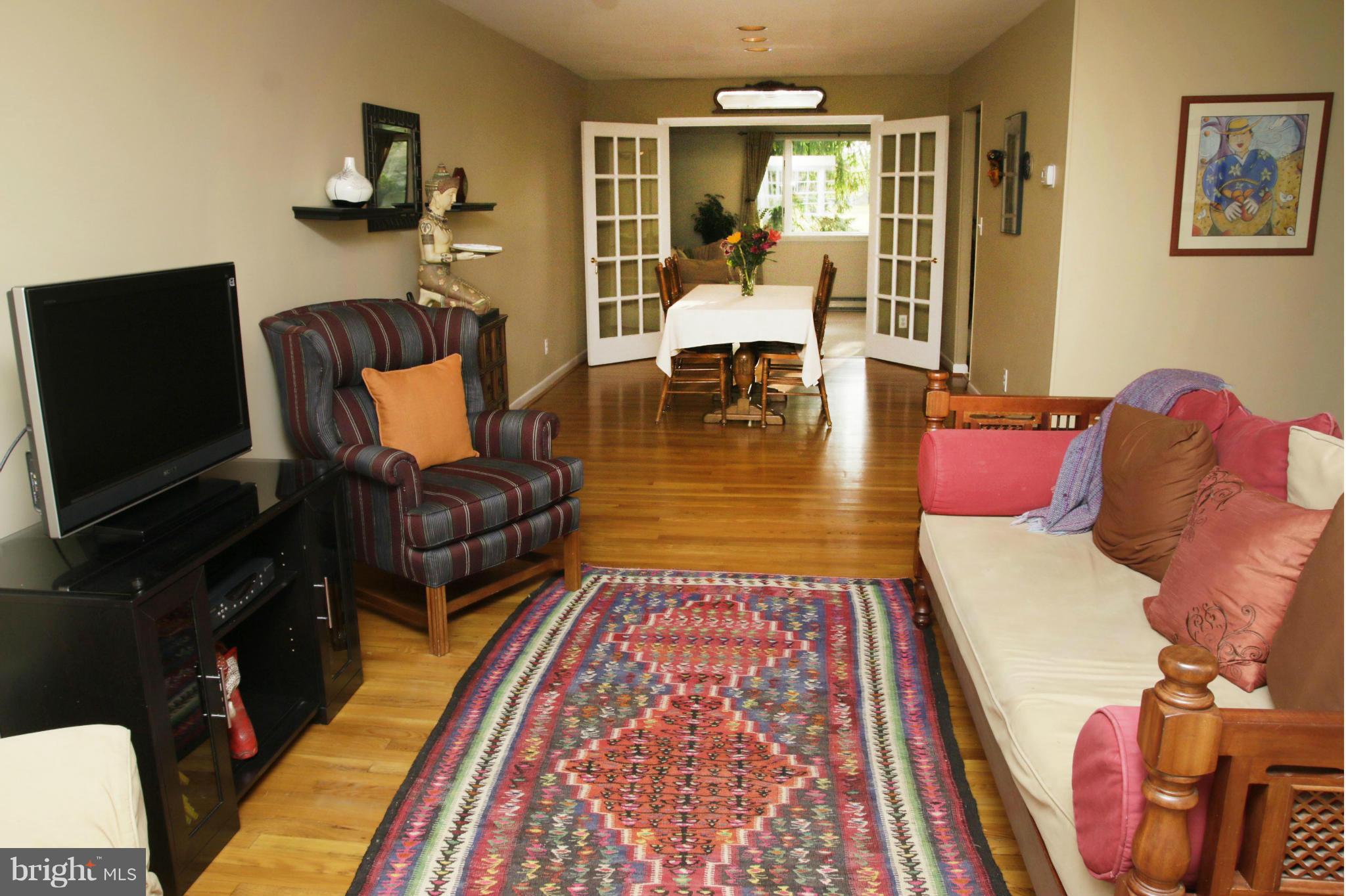 4019 Starbrook Road Randallstown, MD 21133 - Photo 3 of 28 a living room with furniture rug and wooden floor
