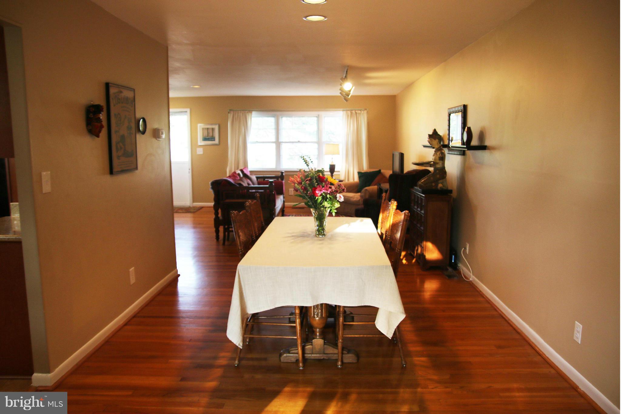 4019 Starbrook Road Randallstown, MD 21133 - Photo 4 of 28 a dining room with furniture and wooden floor