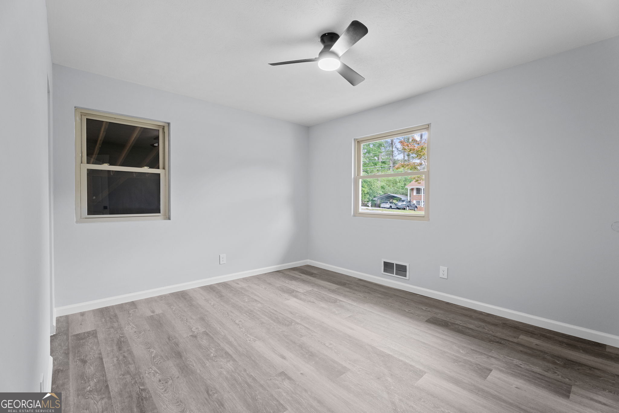 6463 Maddox Road Morrow, GA 30260 - Photo 21 of 46 a view of room with window and ceiling fan
