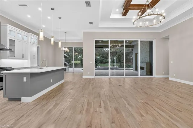 a kitchen with a refrigerator and cabinets