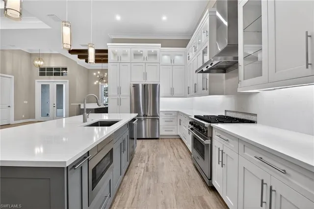 a kitchen with a refrigerator and a sink