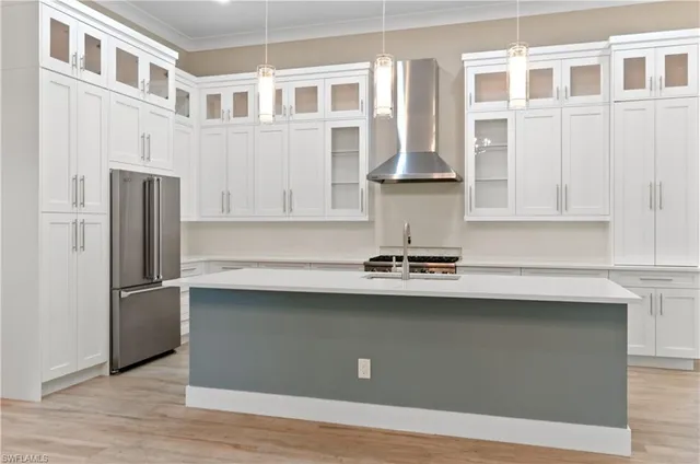 a view of a dining room with furniture large windows and wooden floor