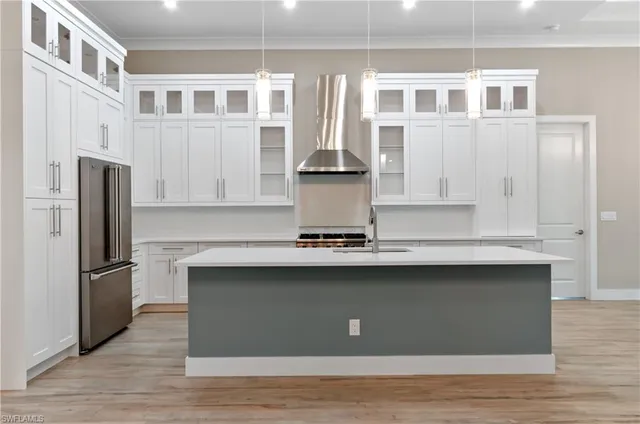 a kitchen with counter top space and stainless steel appliances