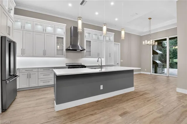a spacious bathroom with a double vanity sink a mirror and a shower