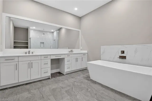 a living room with furniture and floor to ceiling window