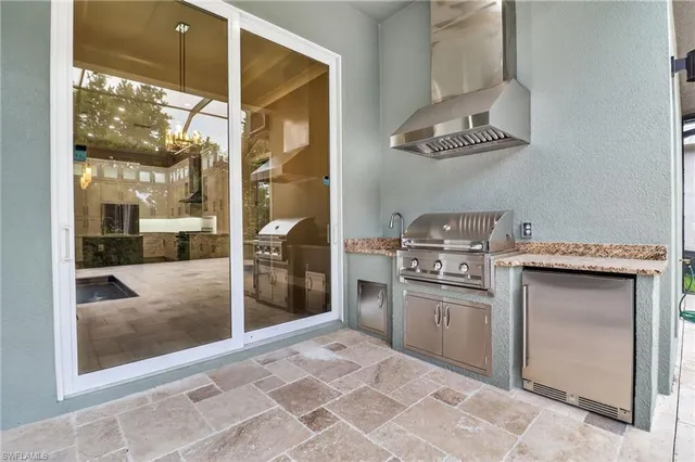 a view of a tennis court with chairs