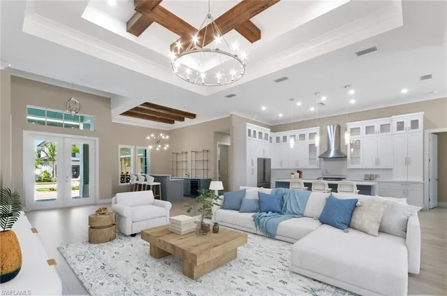 a view of large kitchen with large windows and wooden floor