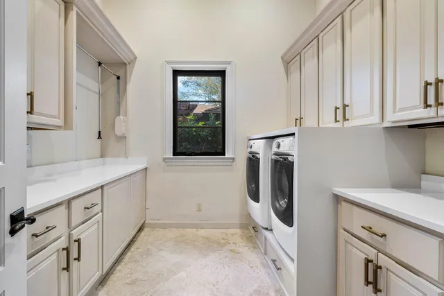 a front view of a house with a yard table and chairs