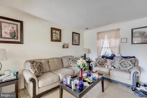 a room with furniture and a flat screen tv