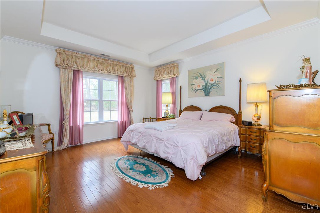 1023 Resolution Drive Bethlehem, PA 18017 - Photo 15 of 26 a spacious bedroom with a bed and wooden floor