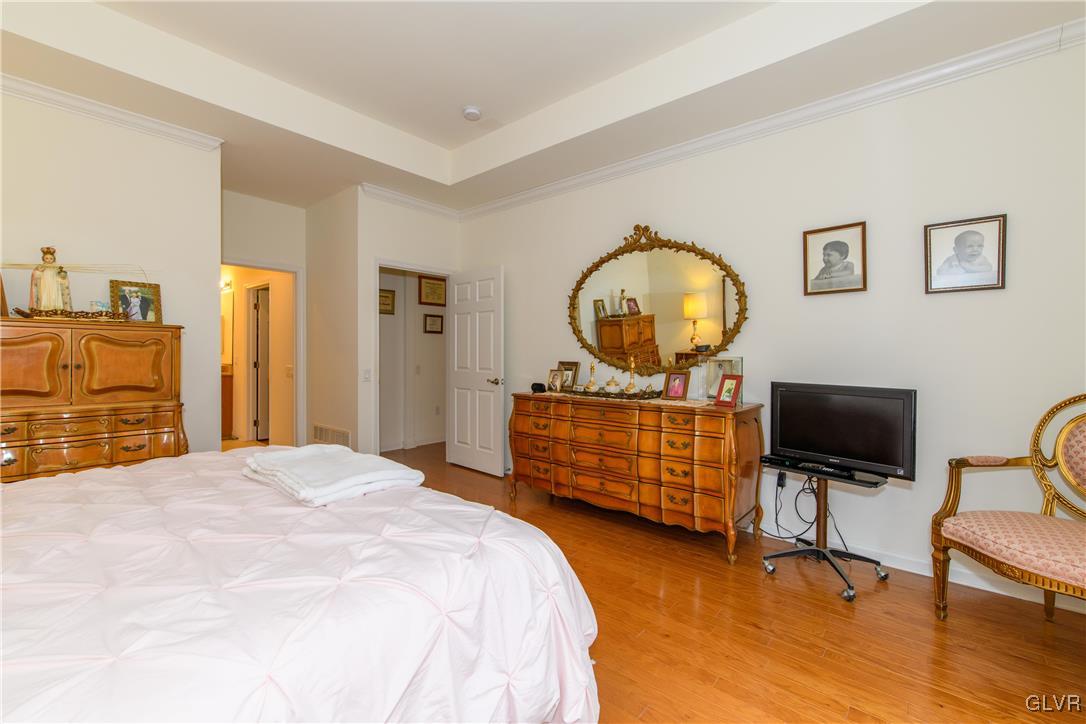 1023 Resolution Drive Bethlehem, PA 18017 - Photo 16 of 26 a bedroom with a bed and wooden floor