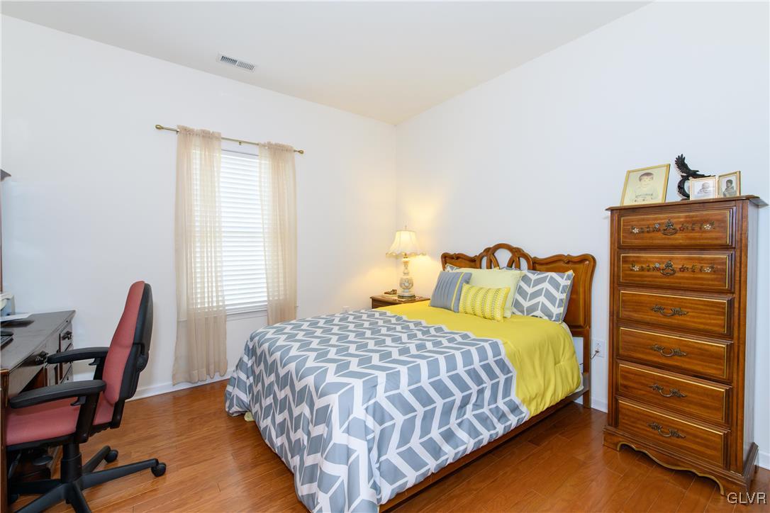 1023 Resolution Drive Bethlehem, PA 18017 - Photo 19 of 26 a bedroom with a bed a dresser and chair