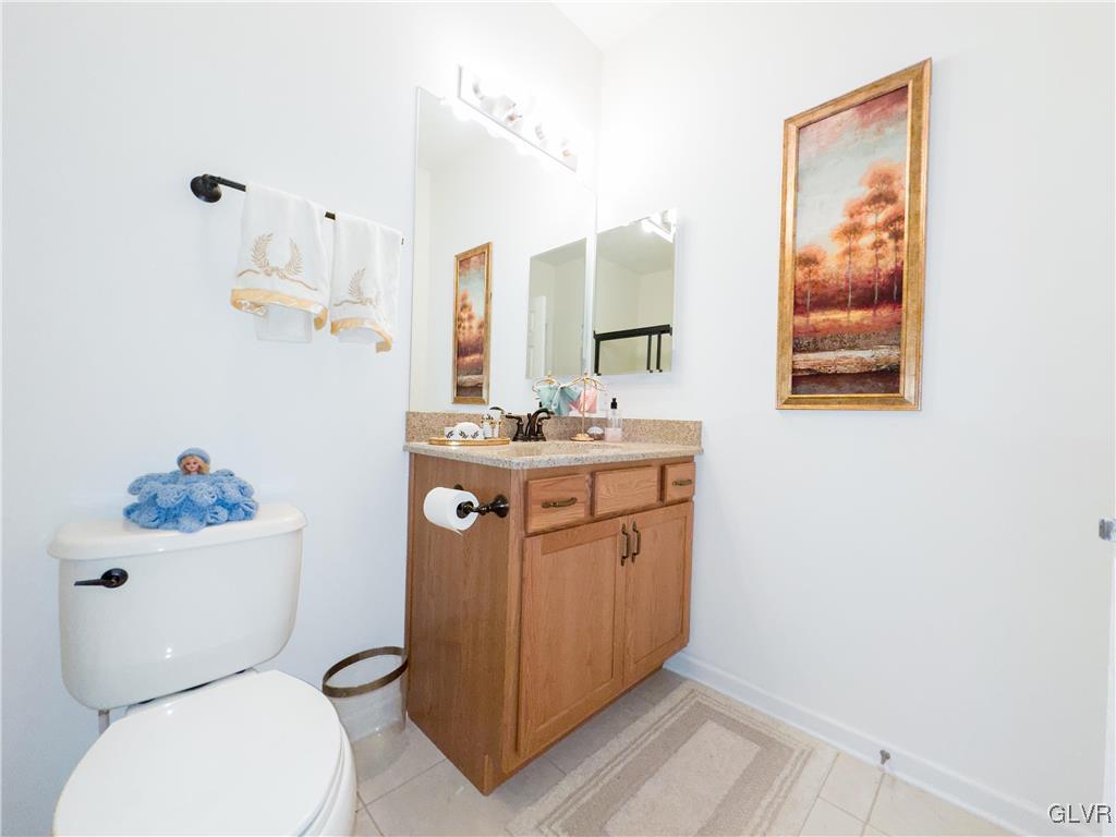 1023 Resolution Drive Bethlehem, PA 18017 - Photo 20 of 26 a bathroom with a toilet a sink and a mirror