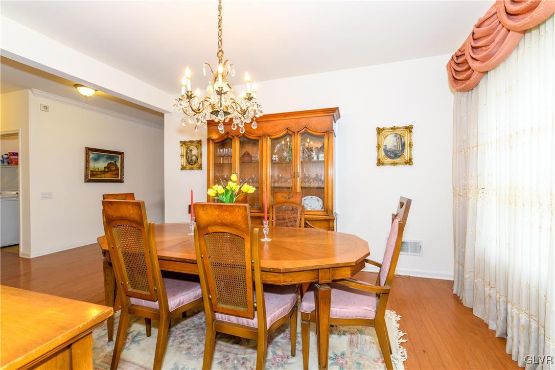 1023 Resolution Drive Bethlehem, PA 18017 - Photo 7 of 26 a dining room with furniture and chandelier