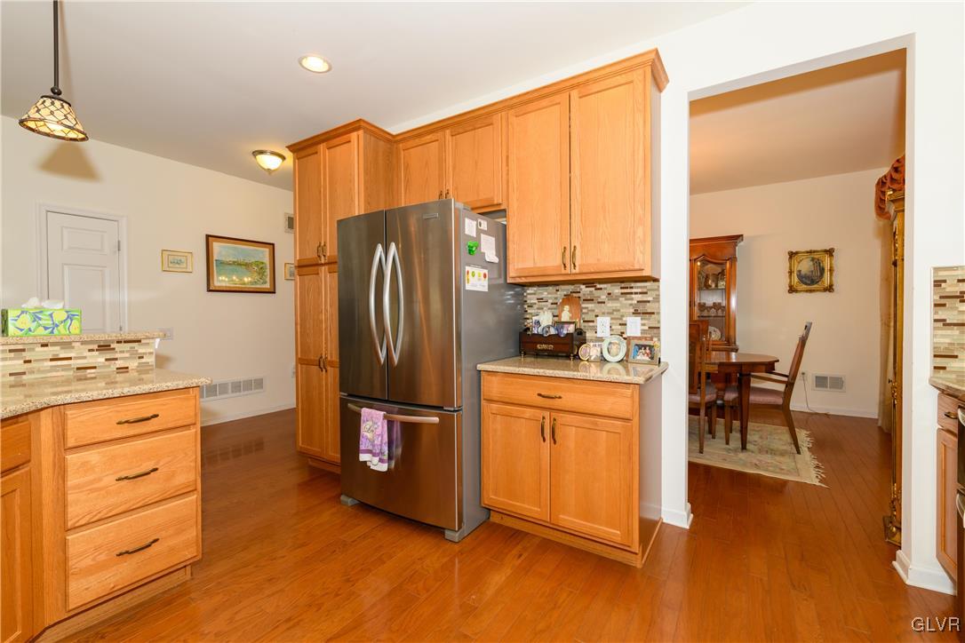 1023 Resolution Drive Bethlehem, PA 18017 - Photo 10 of 26 a kitchen with stainless steel appliances granite countertop a refrigerator and a stove top oven