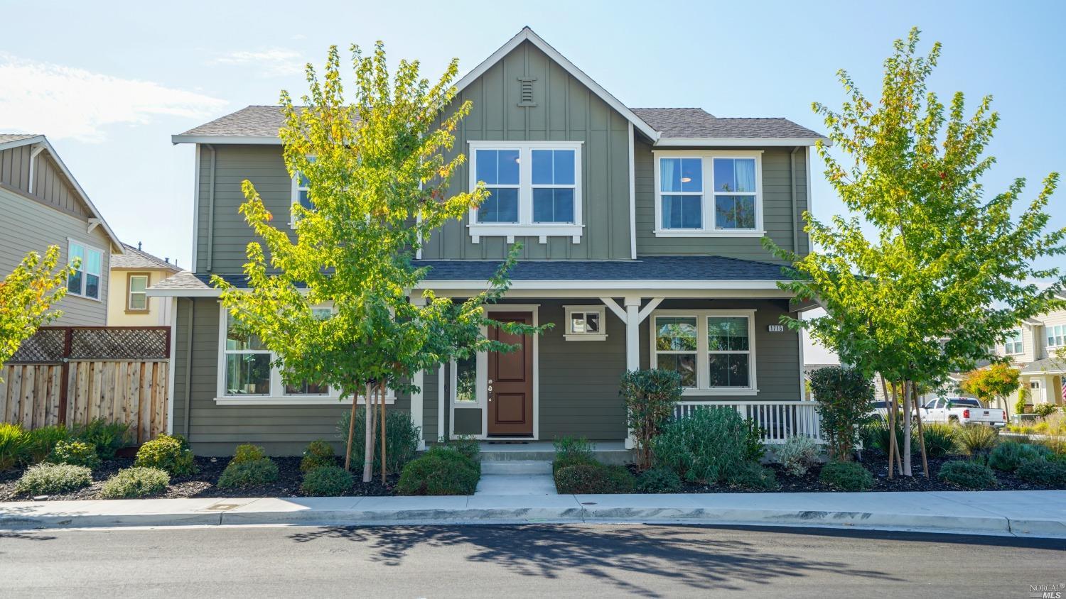 1715 Warmstone Way Rohnert Park, CA 94928 - Photo 1 of 1 a front view of a house with a yard and garage