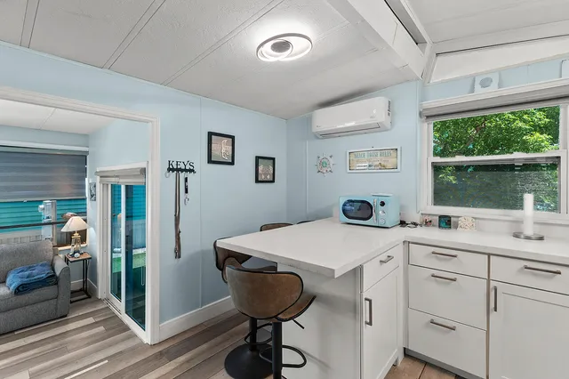 a bed room with two bed and a large window