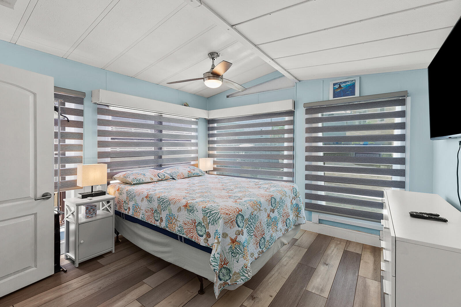 65821 Overseas Highway, Unit 35 Long Key, FL 33001 - Photo 22 of 82 a bedroom with a bed and a chandelier