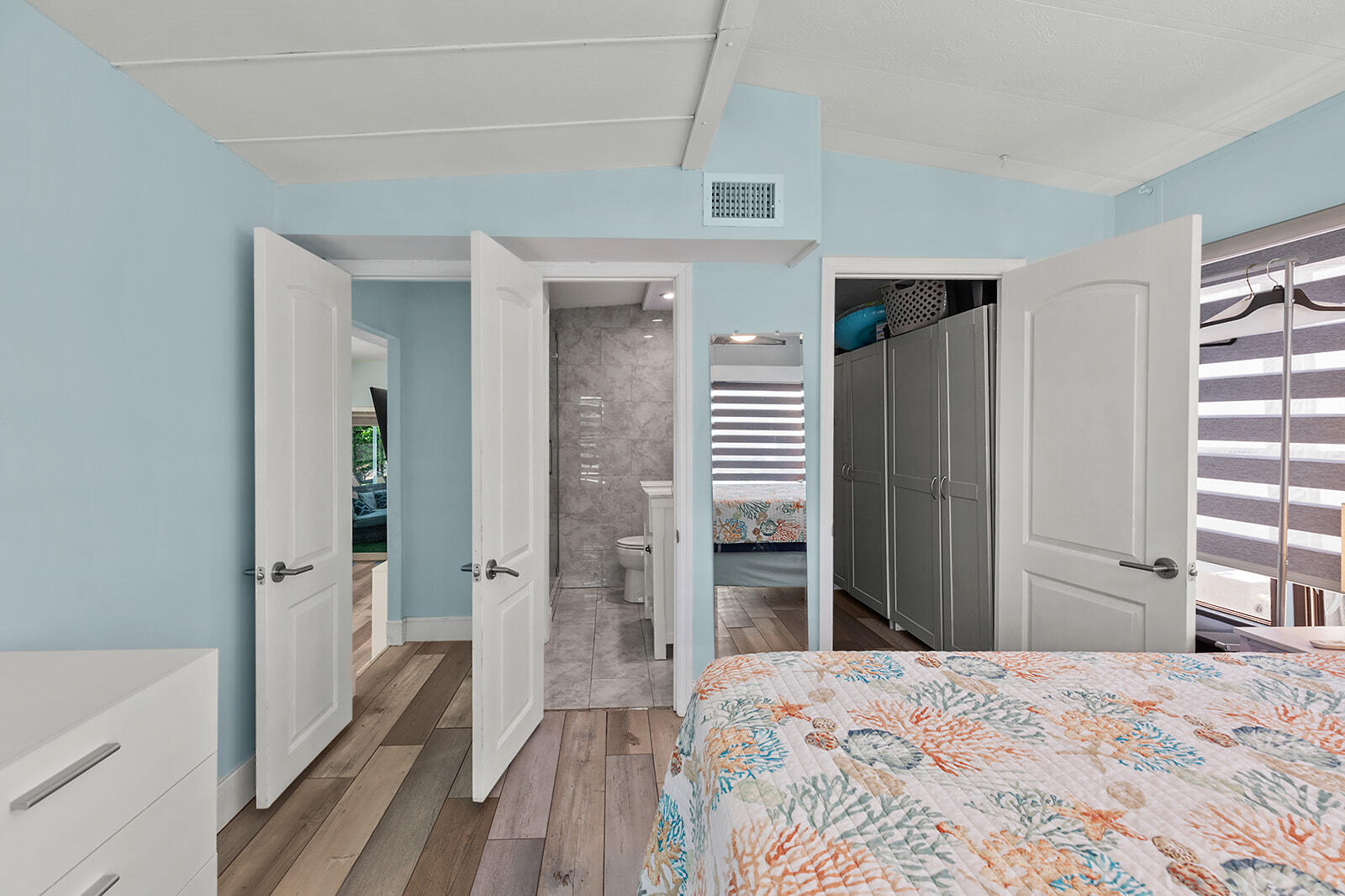 65821 Overseas Highway, Unit 35 Long Key, FL 33001 - Photo 23 of 82 a view of a bedroom with wooden floor and balcony