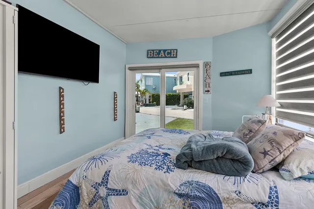 a view of a patio with swimming pool table and chairs