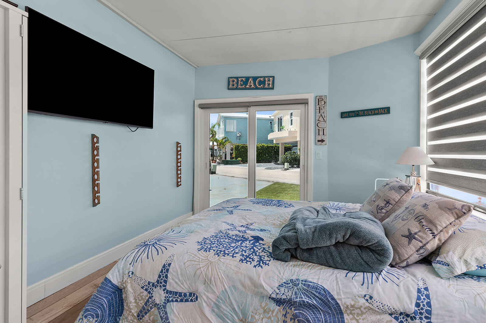65821 Overseas Highway, Unit 35 Long Key, FL 33001 - Photo 28 of 82 a bedroom with a bed and a flat screen tv