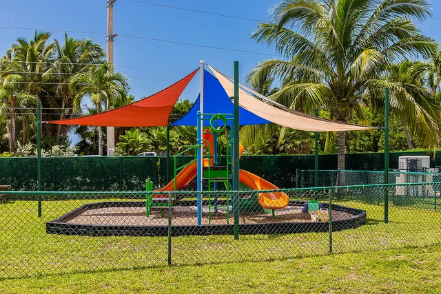 a living room with furniture a rug and a large window