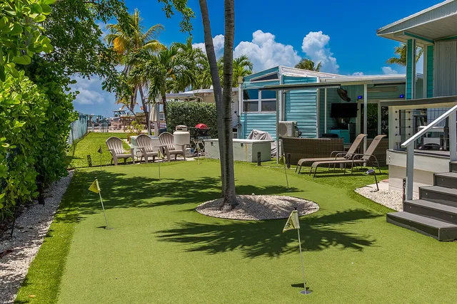 a backyard of a house with sofas