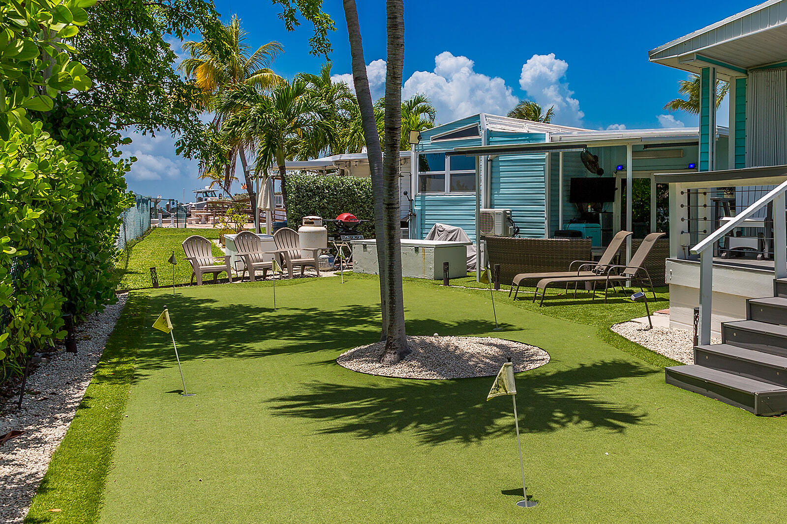 65821 Overseas Highway, Unit 35 Long Key, FL 33001 - Photo 4 of 82 a view of a house with backyard swimming pool and sitting area