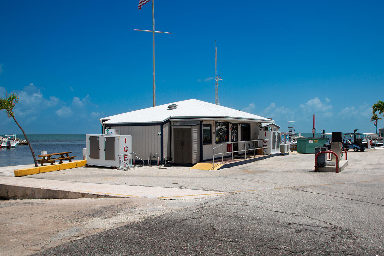 65821 Overseas Highway, Unit 35 Long Key, FL 33001 - Photo 44 of 82 a view of a roof deck with table and chairs under an umbrella