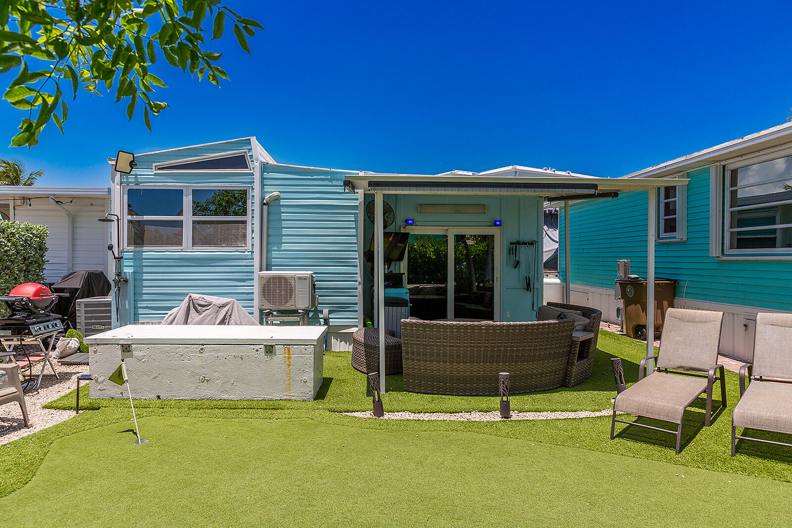 65821 Overseas Highway, Unit 35 Long Key, FL 33001 - Photo 6 of 82 a backyard of a house with sofas