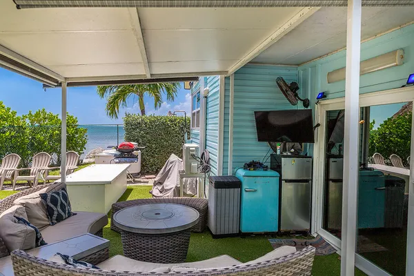 a kitchen with stainless steel appliances granite countertop a refrigerator and a refrigerator