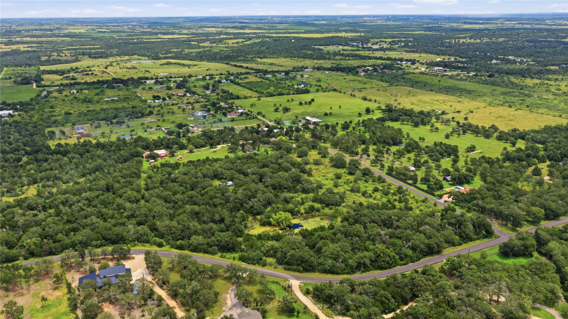 10312 Parsons Road Manor, TX 78653 - Photo 3 of 26 Vast, verdant landscape offering a peaceful escape with ample space for development.