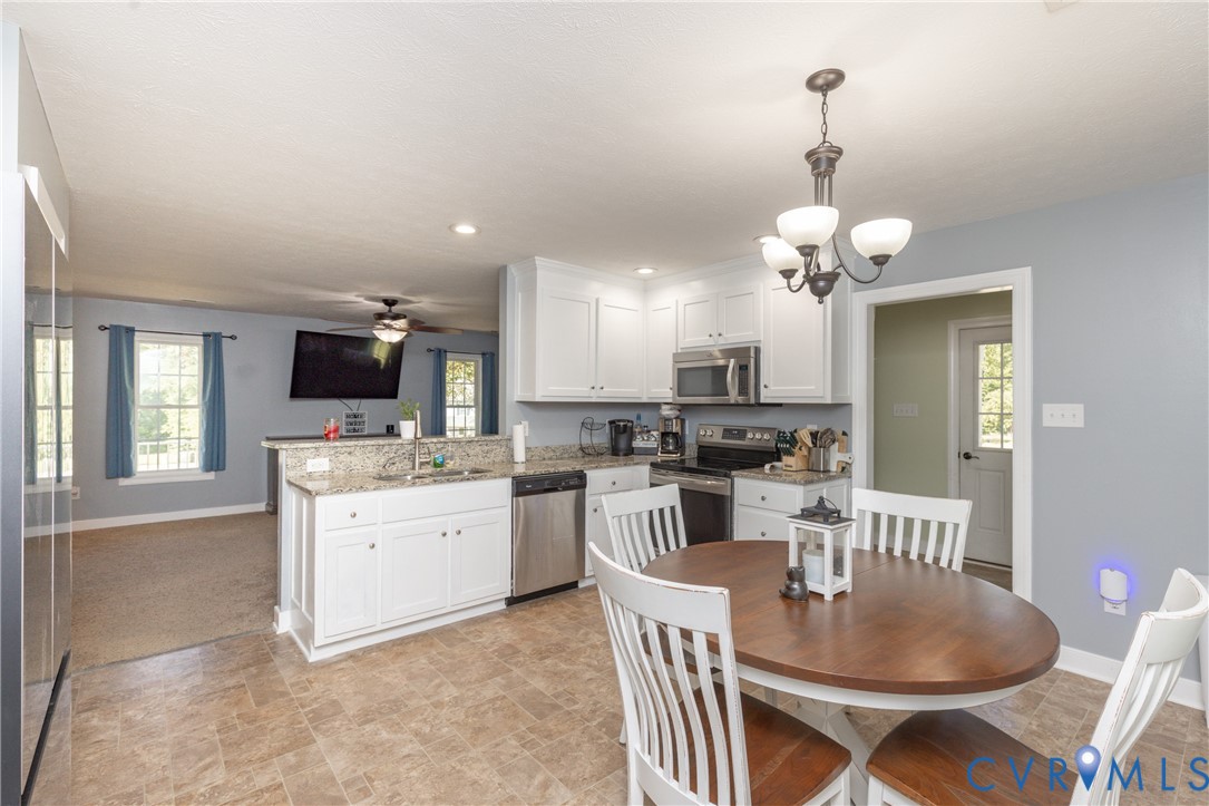 219 Pine Ridge Road Aylett, VA 23009 - Photo 12 of 38 Granite countertops and stainless steel appliances