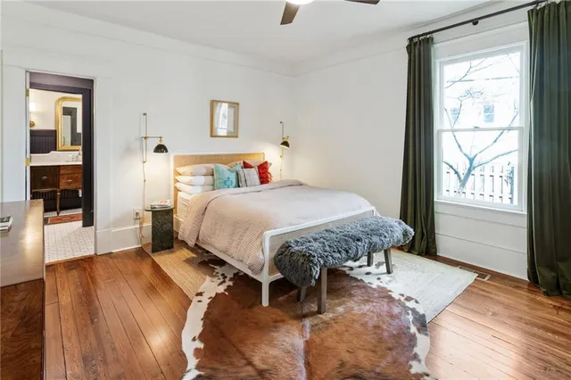 a bedroom with a bed and window