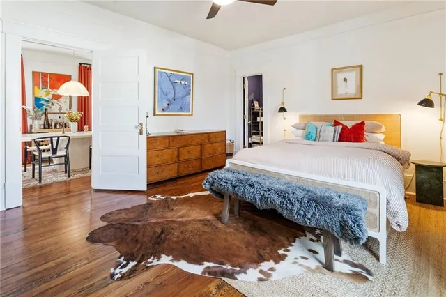 a bedroom with a bed and a dresser